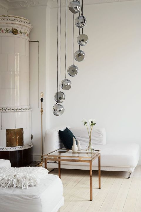 white scandinavian living room with modern lighting