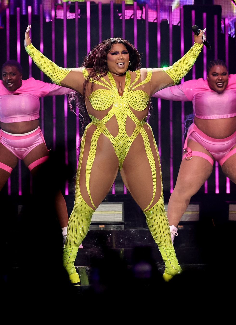 Lizzo Channels Spider-Woman in a Neon and Nude Illusion Catsuit