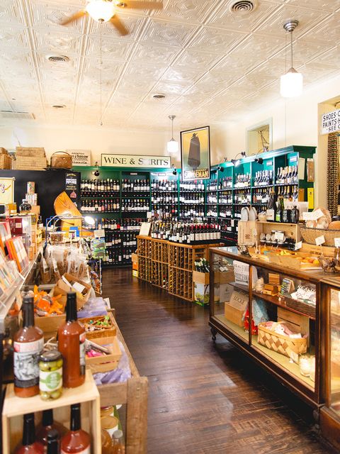 shelves of wine bottles and cheeses in the locke store in millwood virginia