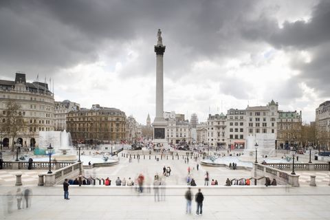 uk, london, tourists at trafalgar square
