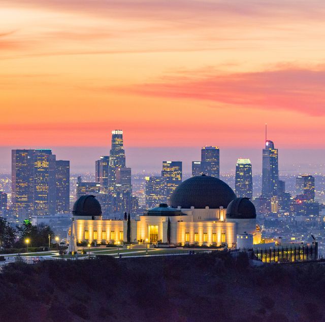 los angeles skyline at dawn panorama and griffith park observatory in the foreground