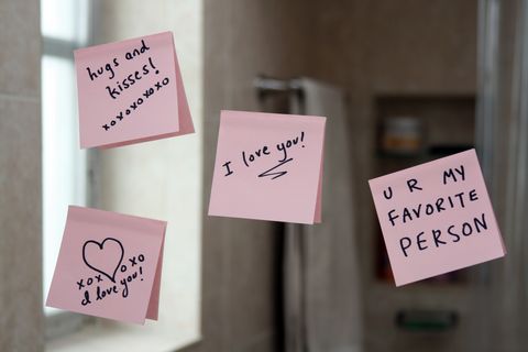 love notes on sticky paper stuck up on a mirror