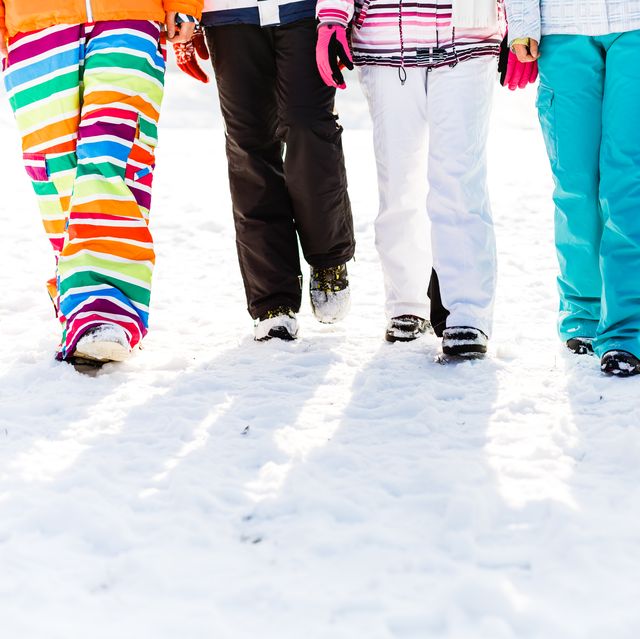 low section of friends in ski wear