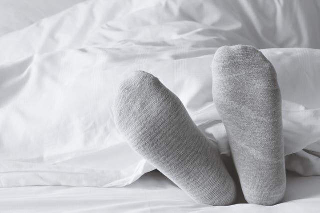 this is why you should wear socks to bed, according to a doctor