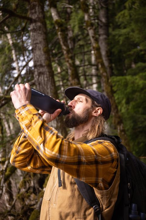 man drinking from lifestraw collapsible bottle