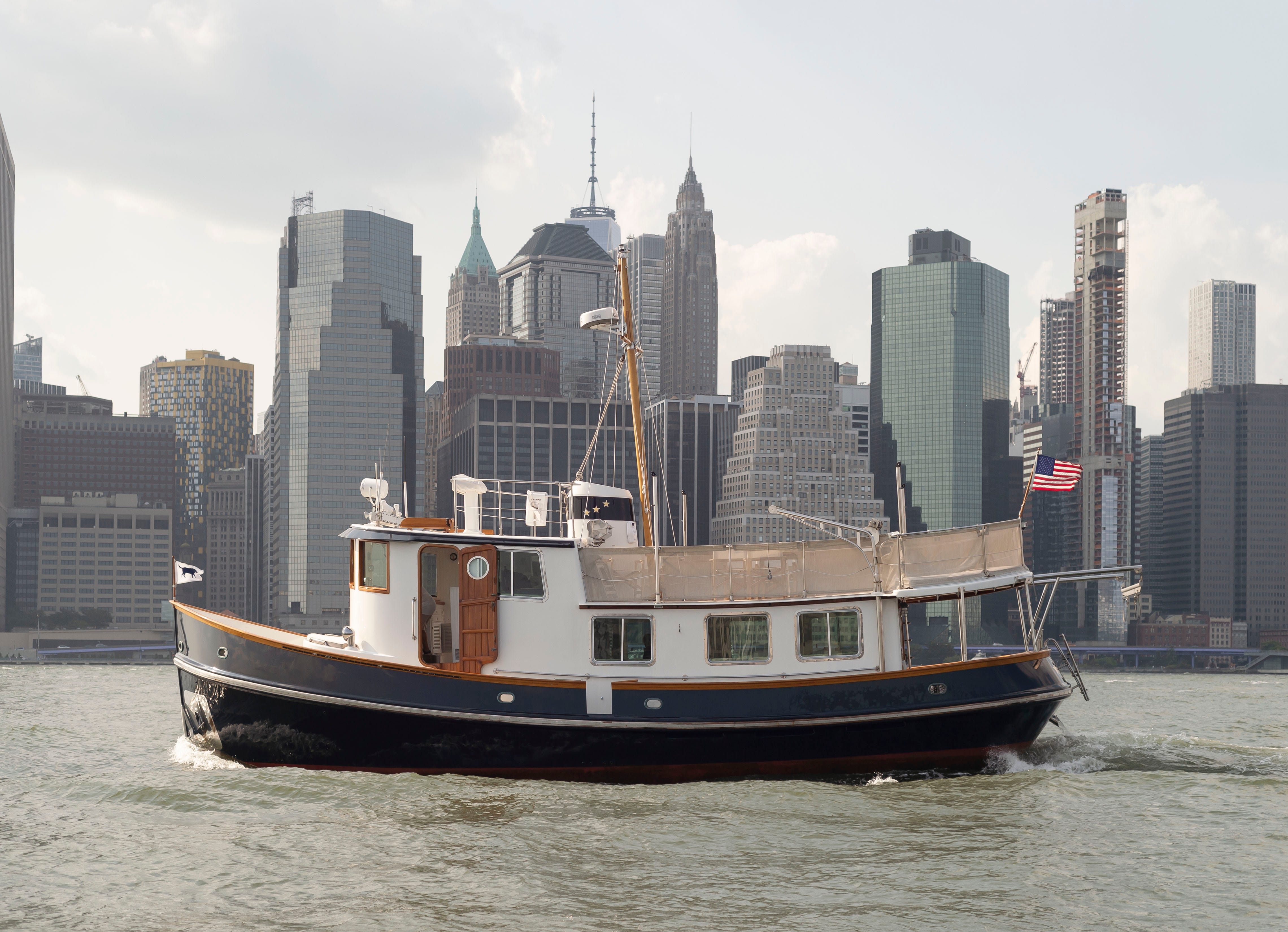 This Tiny Renovated NYC Tugboat Contains a Full Cottage Home!