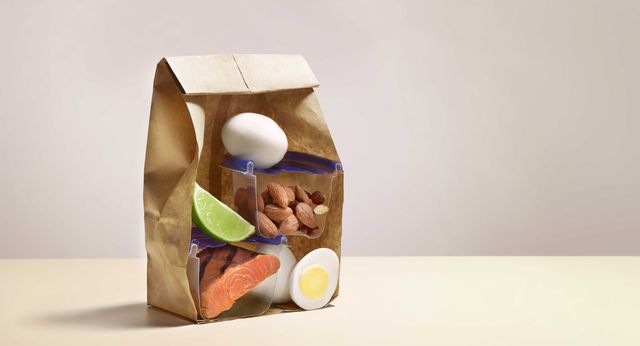brown bag with healthy lunch, lunch hour, healthy fats, egg, salmon, almonds