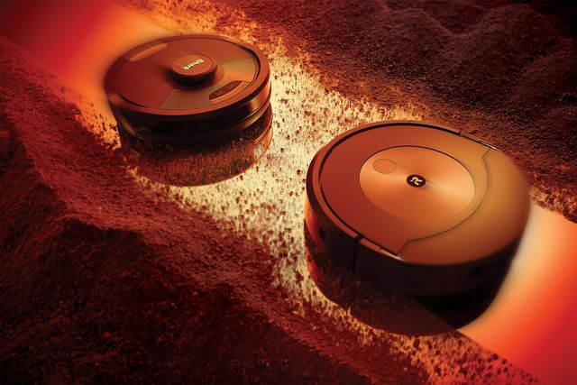 two robot vacuums heading towards each other cleaning piles of dirt