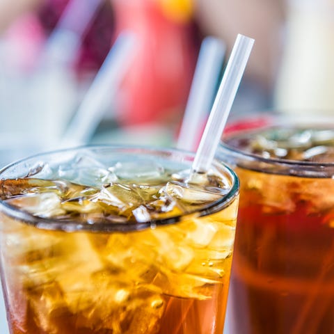 Macro closeup of iced tea or soda with ice cubes and straw in glass What Types of Food To Eat and Avoiding