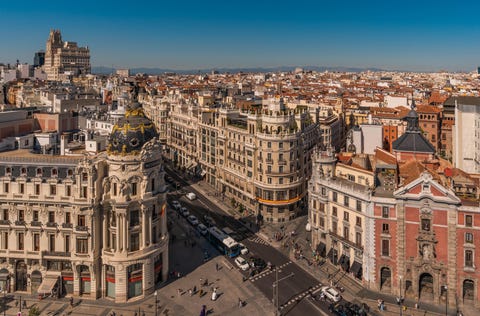 downtown madrid, spain, where the calle de alcala meets the gran via these are two of the most famous and busy streets in madrid