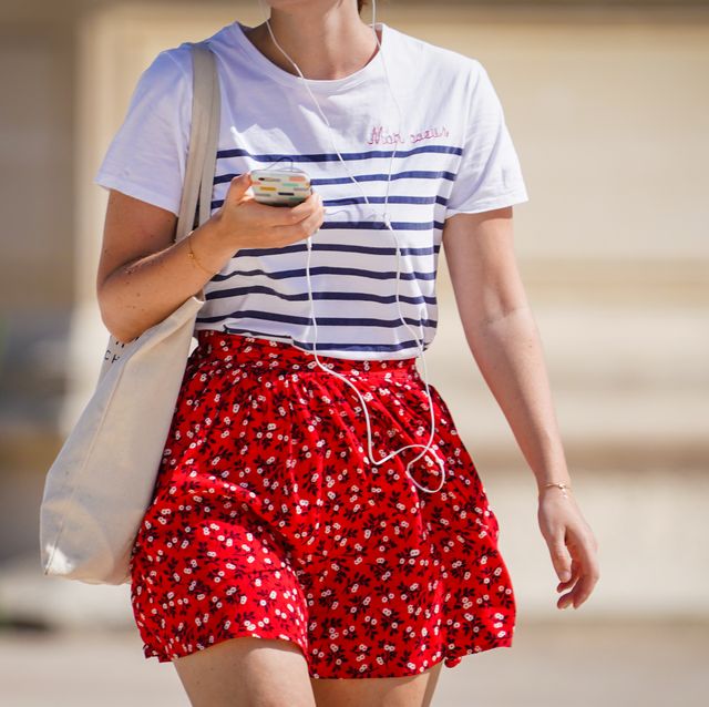 paris, france   may 31 a passerby wears a white striped t shirt, a red short floral print skirt, a tote bag, on may 31, 2020 in paris, france photo by edward berthelotgetty images