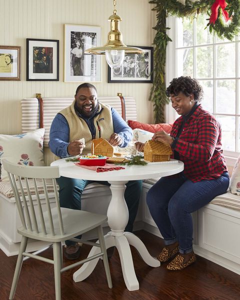 victoria and marcus ford in the built in banquette in their kitchen