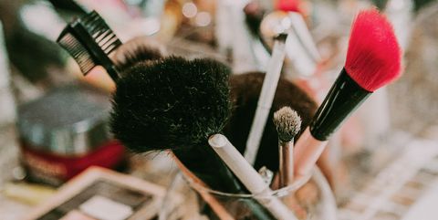 makeup brushes and cosmetic on bathroom