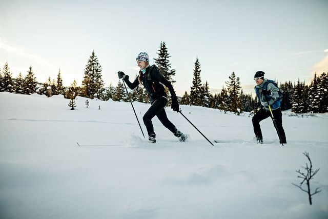 male and female athletes having fun on skis