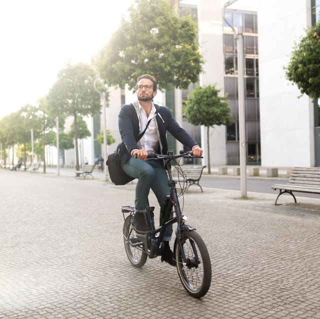 male commuter with electric bike in mitte