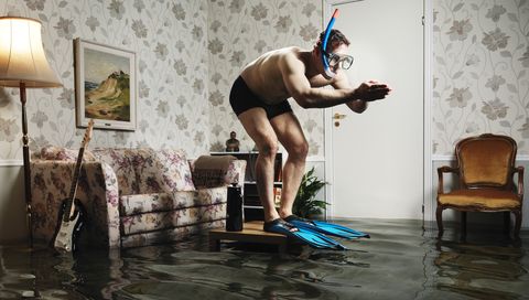 male swimmer in flooded living room