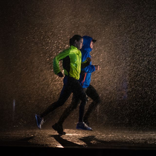 man and woman jogging in city