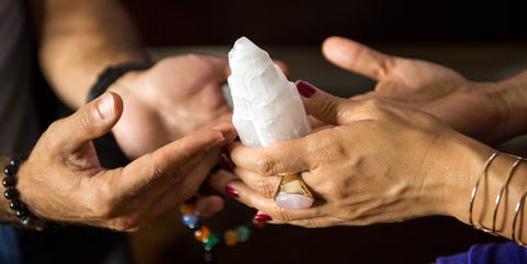 Man and woman pass crystal back and forth