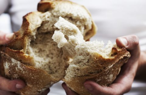 Man breaking bread
