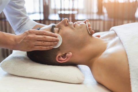 Man getting facial treatment at beauty salon Man getting facial treatment at beauty salon