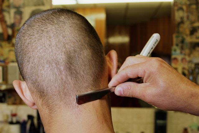 man having haircut rear view, close up