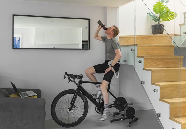 man on his turbo trainer at home