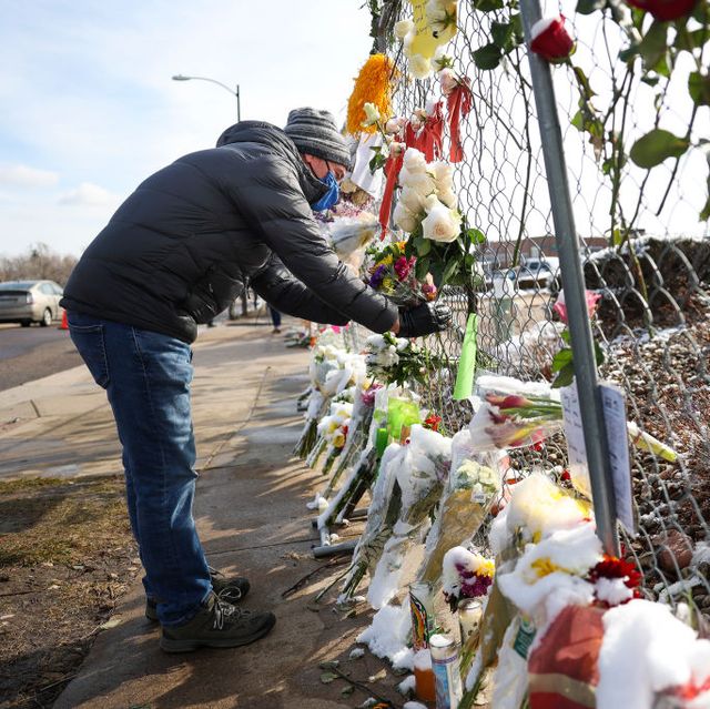 boulder, co   march 24 a man places flowers in the fence at a makeshift memorial for the victims of a mass shooting outside a king soopers grocery store on march 24, 2021 in boulder, colorado ten people, including a police officer, were killed in the shooting on mondayphoto by michael ciaglogetty images