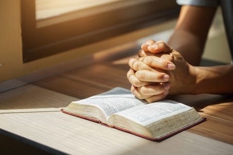 a man reading the holy bible