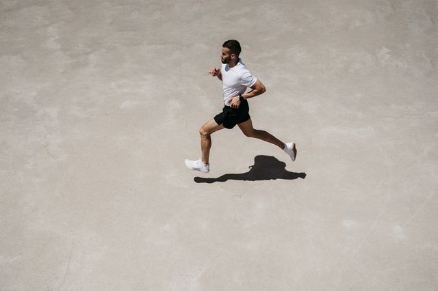 man running outdoors in sunshine