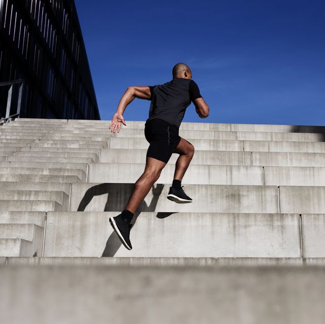 man running up outdoor stairs