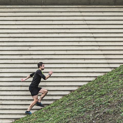 Man running up steep hill