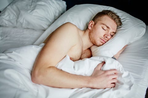 man sleeping in bed