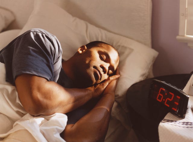 sleep weight loss man sleeping in bed