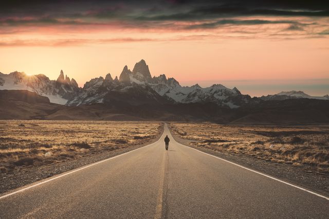 man walking alone on the road to fitz roy, patagonia argentina