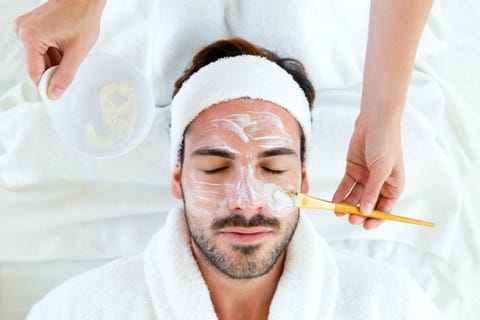 Man with clay facial mask in beauty spa. Man with clay facial mask in beauty spa.