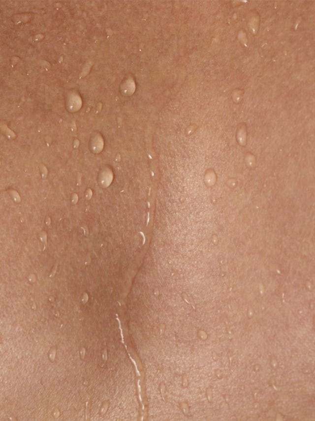 Man with wet bare chest, mid section, close-up, full frame skin hyaluronic acid