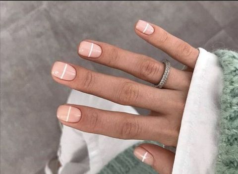 minimalist and elegant white striped manicure
