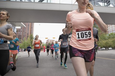 Marathon runners running on urban street