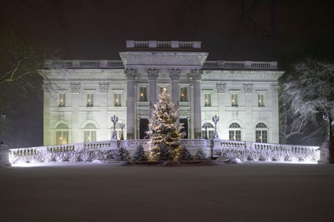 The exterior of the Marble House at night.