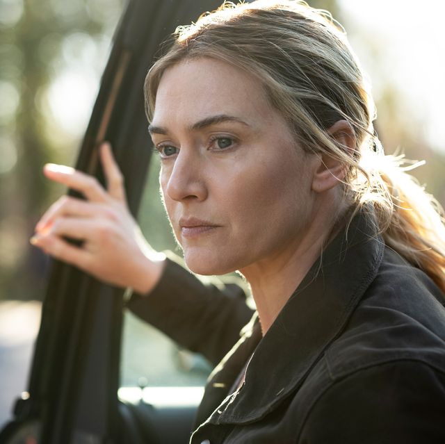 kate winslet climbing out of a car in mare of easttown