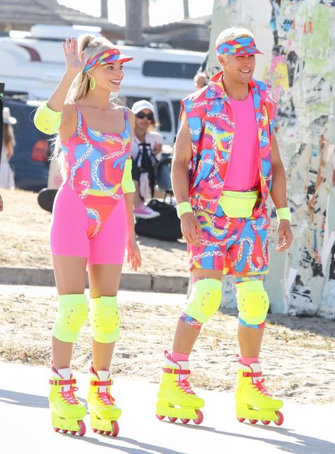 robbie with ryan gosling as her ken while shooting the barbie movie in her roller skating outfit﻿