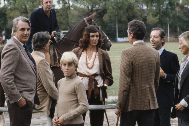 marina lante della rovere stands talking with a  group of people while attending a polo match at the borghese gardens in rome, italy, in november 1980 a rider on horseback is in the background photo by slim aaronsgetty images