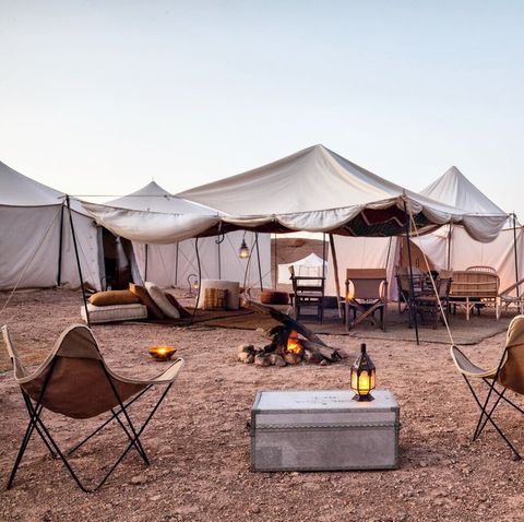 glamping in the desert in marrakech , tends and chairs