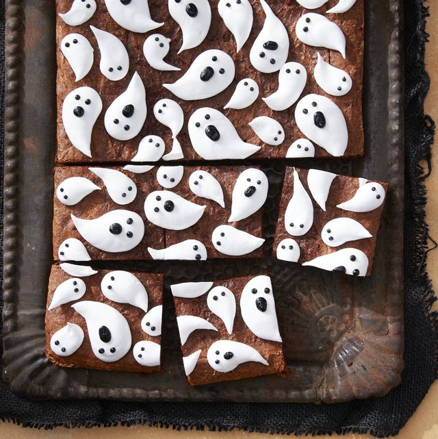 a tray of brownies with marshmallow ghosts all over