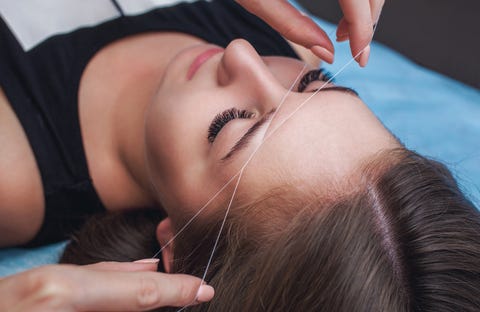 Master in the cabin removes facial hair strand. Master in the cabin removes facial hair strand.