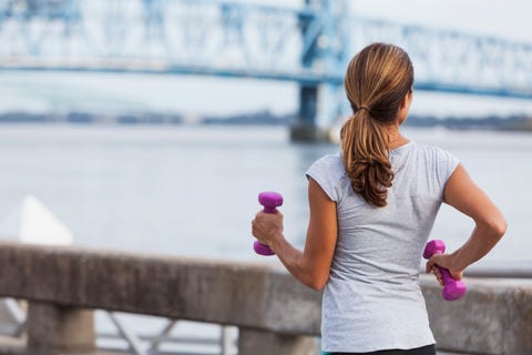 mature woman jogging or power walking on waterfront