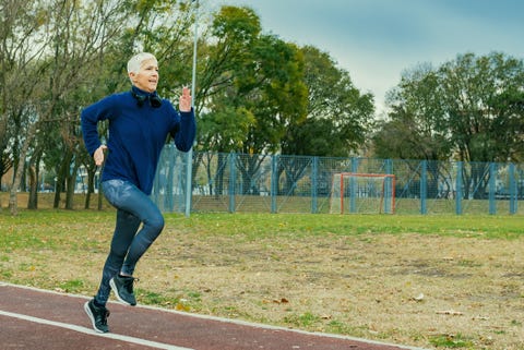 Mature Woman Running Across the Bridge