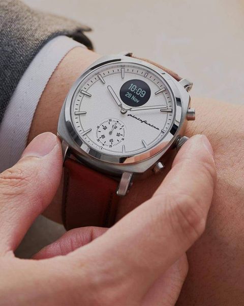 a person wearing a watch on their wrist
