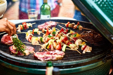 fresh healthy food grilling on bbq, meat cooking with cubed mediterranean vegetables, sizzling, temptation, party
