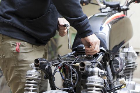 mechanic customizing motorcycle